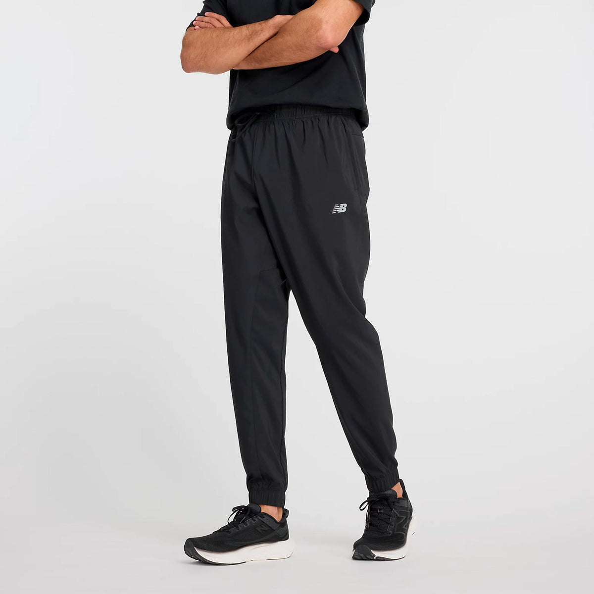 New Balance Essentials Woven Trainingshose Herren - schwarz